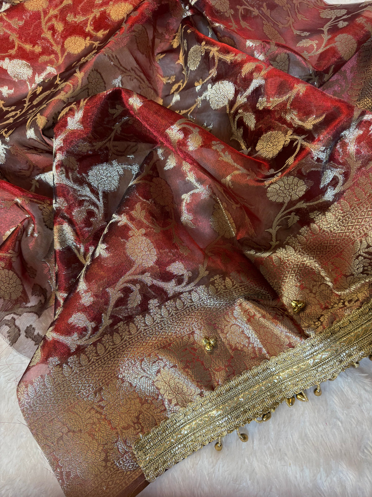 Carmine Red Tissue Silk Saree With Golden Ghungroo Butti Work & Luxury Lace Border