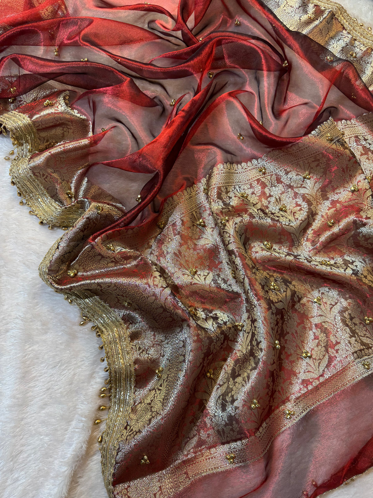 Carmine Red Tissue Silk Saree With Golden Ghungroo Butti Work & Luxury Lace Border