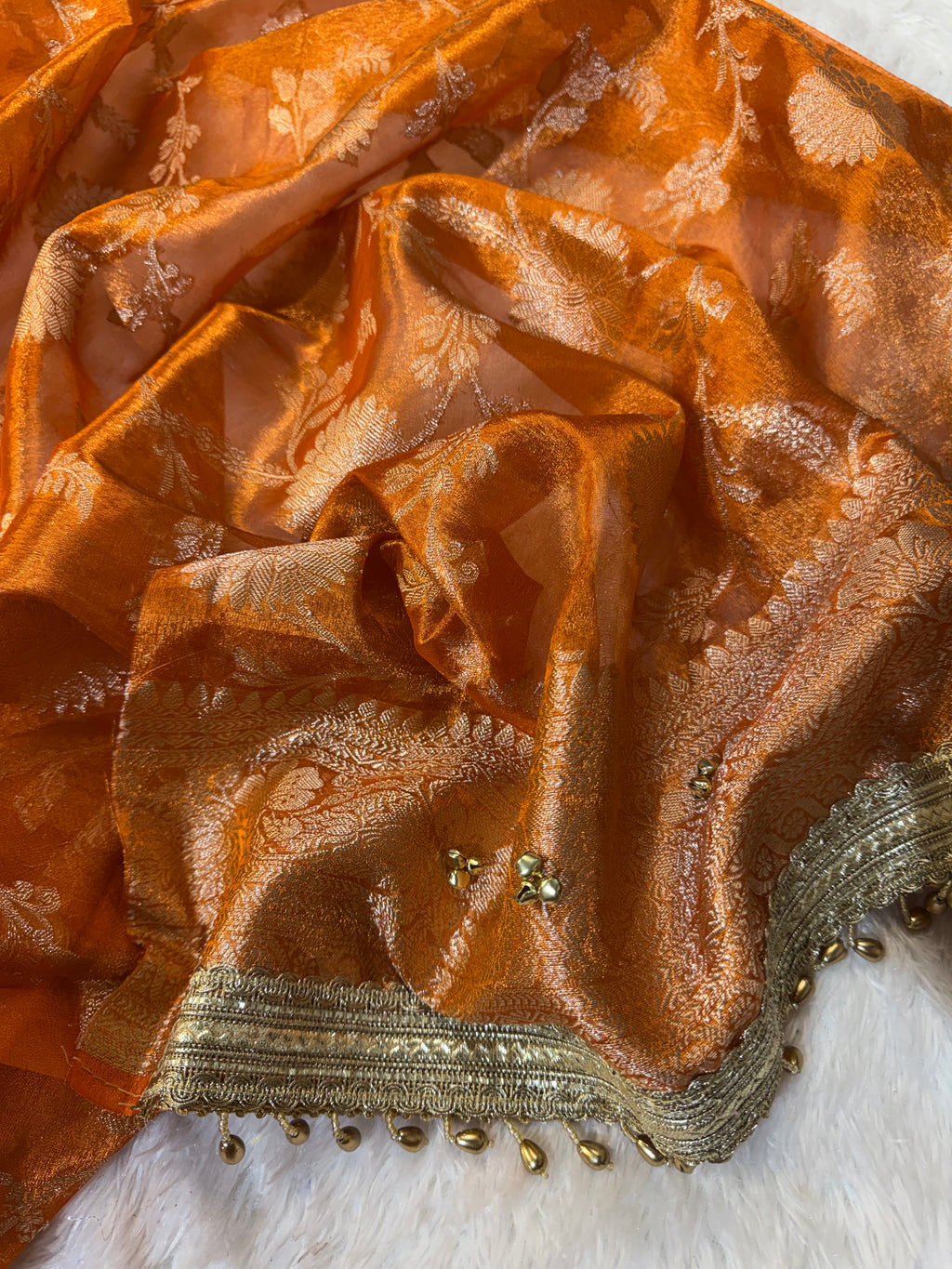 Orange Tissue Silk Saree With Golden Ghungroo Butti Work & Luxury Lace Border