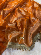 Orange Tissue Silk Saree With Golden Ghungroo Butti Work & Luxury Lace Border