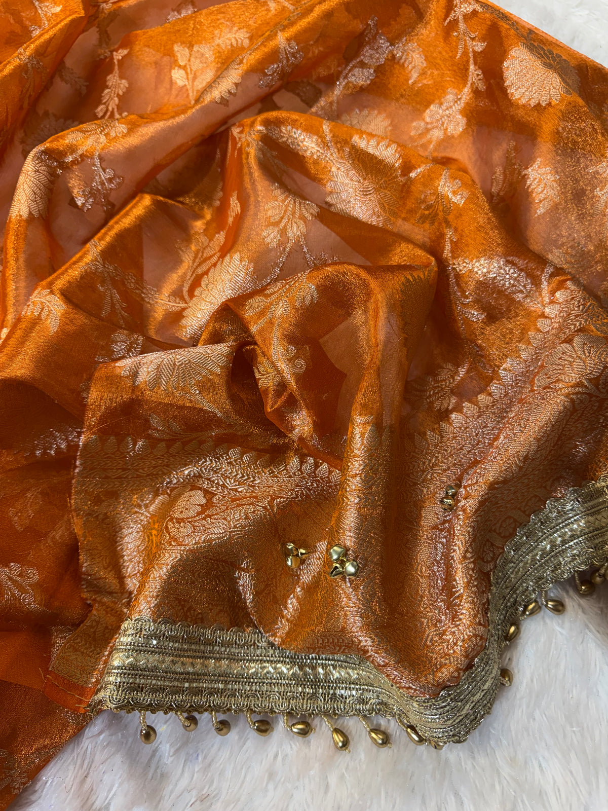 Orange Tissue Silk Saree With Golden Ghungroo Butti Work & Luxury Lace Border